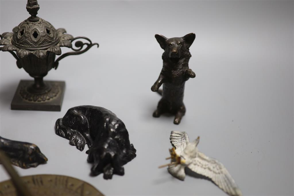 A collection of bronze and metal animals, sun dial and lidded urns etc
